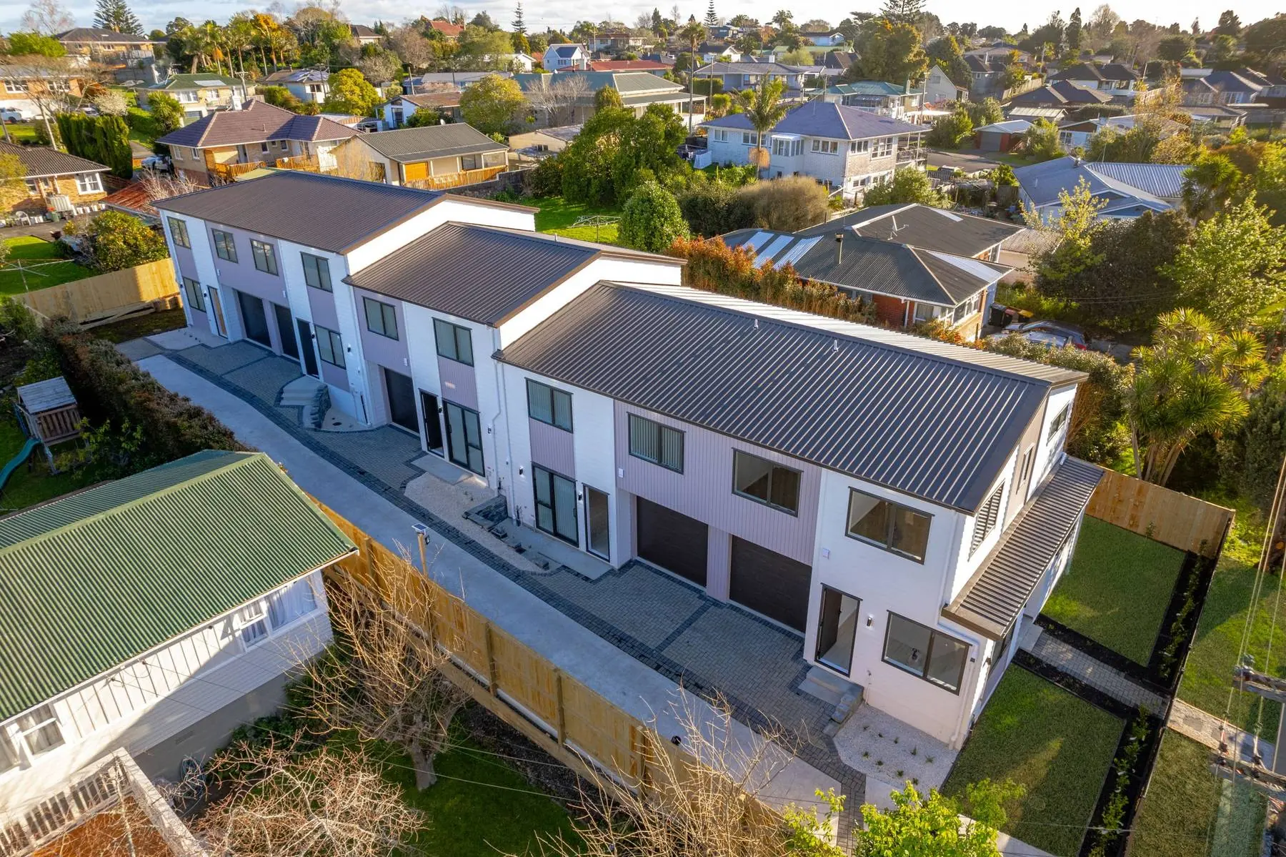 Aerial view of the Tasman Drive townhouses in their street